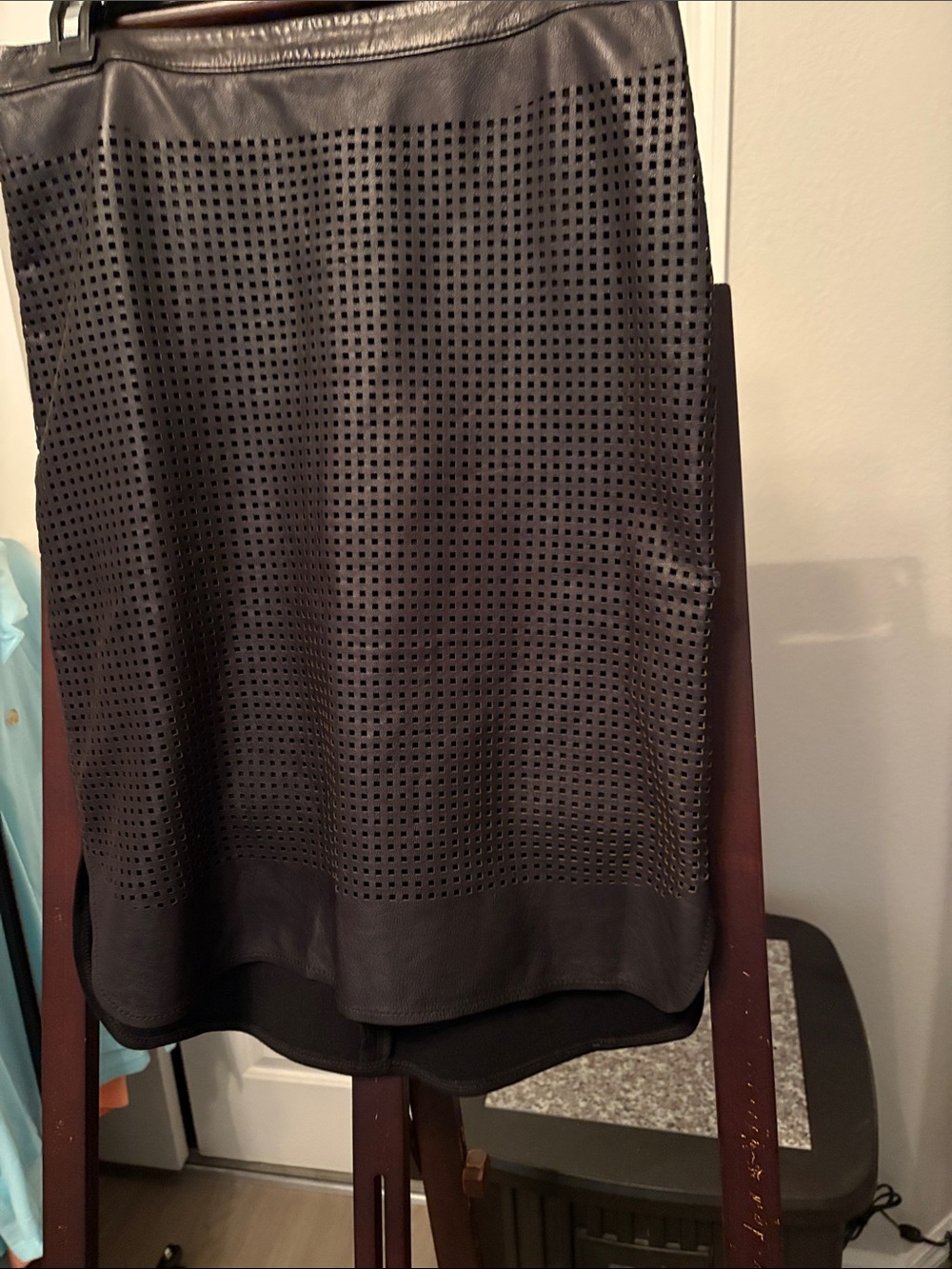 Black Perforated Leather Skirt, longer in back on knit side.